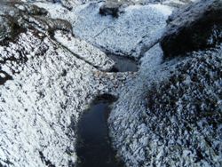 Image of a gully a few weeks after blocking covered in snow