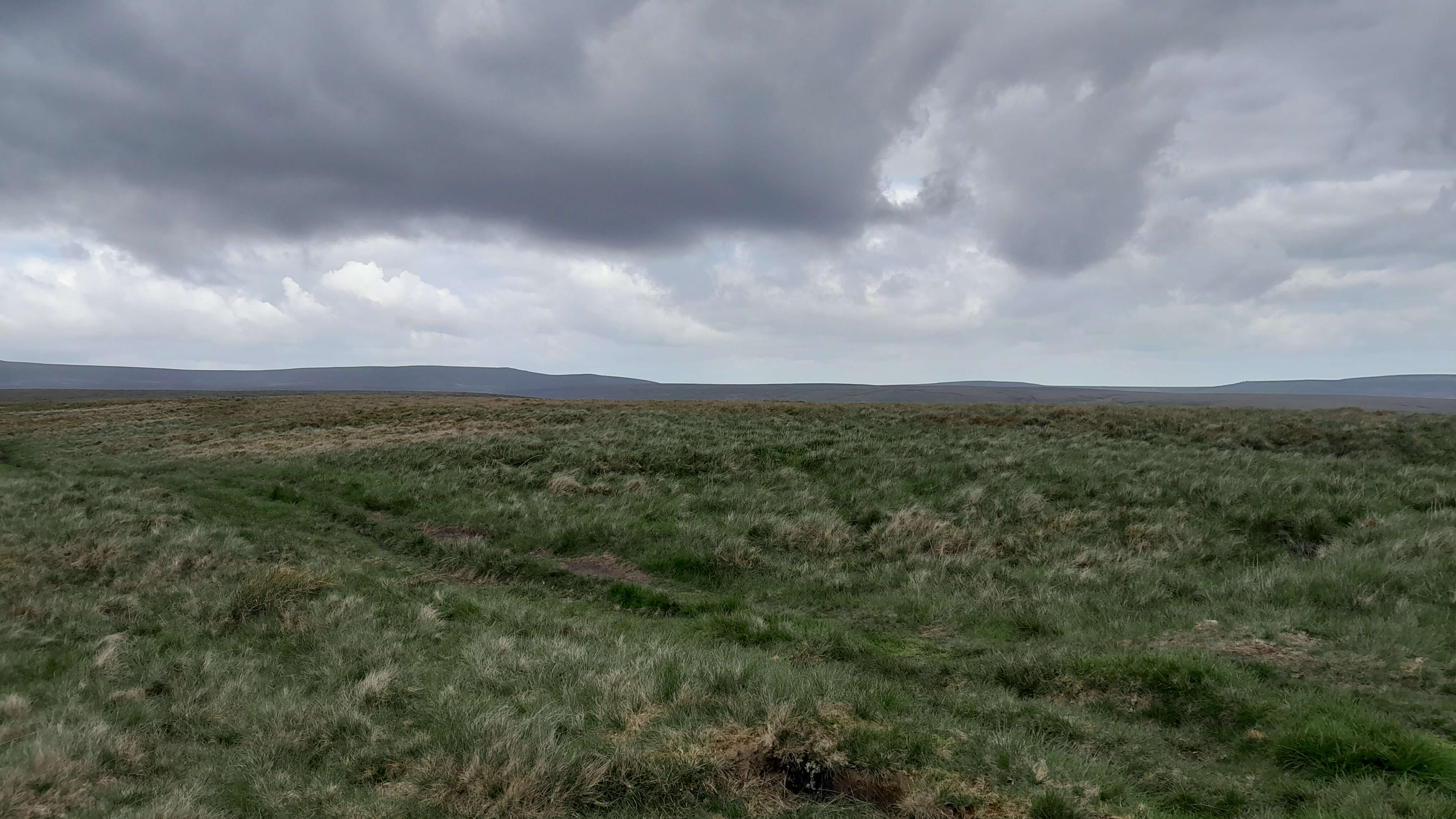 People walking in vast landscape